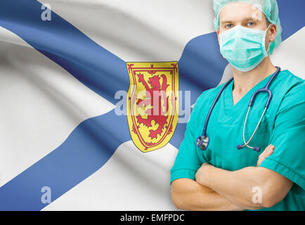 Surgeon with Canadian privinces flag on background - Nova Scotia Stock Photo