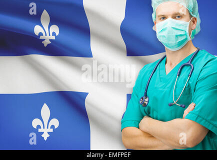 Surgeon with Canadian privinces flag on background - Quebec Stock Photo