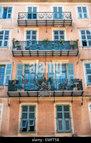 Facade of apartment building with ornate balconies in Nice, France. Stock Photo