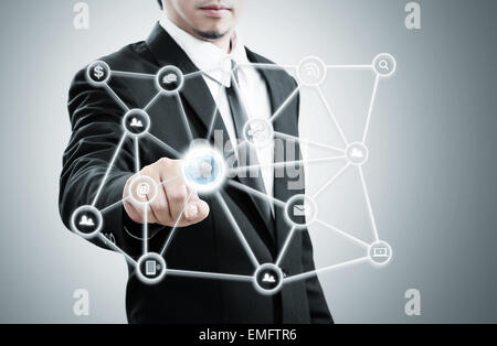 Businessman hand pushing social network world wide Stock Photo