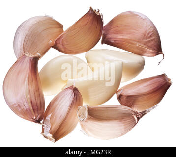 Lots of garlic cloves isolated on a white background. Stock Photo