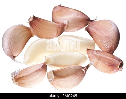 Lots of garlic cloves isolated on a white background. Stock Photo