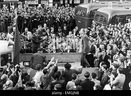 Sir Oswald Mosley prepares for his address by climbing on to the back of a lorry. He was met by a hail of missiles including rotten fruit, pennies and stones as people tried to storm the platform. His speech was drowned out by continuous chorus of 'down with the fascists'. 2nd August 1962 Stock Photo