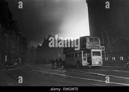 Blitz: Taken from the German word Blitzkrieg ('lightning war'), this was the British name for the Luftwaffe's sustained night attacks against their cities from September 7th 1940 to midway 1941. View of a London bus and St. Paul's church yard during a winter night time raid which caused large fires in the city. 29th December 1940. Stock Photo