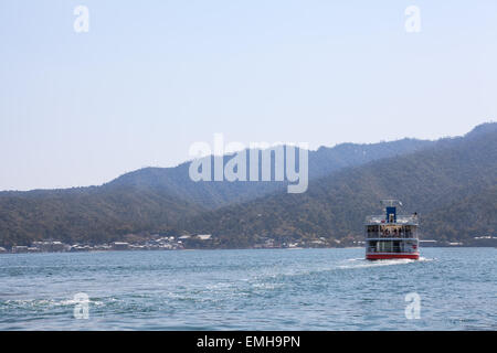 Ferry-boat of JR company is in the Hiroshima gulf. Route to the island of Miyajima (Itsukushima). Japan Stock Photo