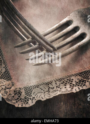 Still life with two forks lying on table, close up. Conceptual image of togetherness, love and intimacy. Stock Photo