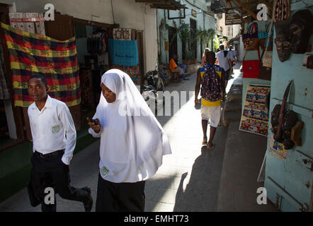 students in traditional dresses in Zanzibar Stock Photo