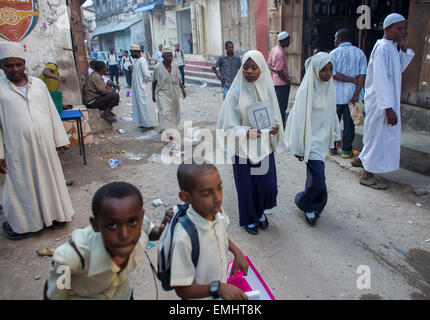 students in traditional dresses in Zanzibar Stock Photo