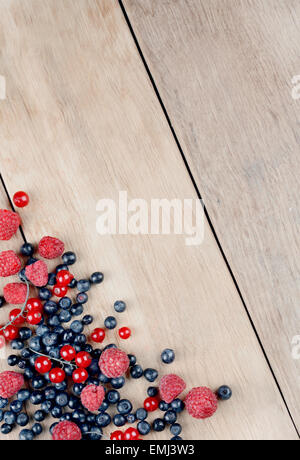 Bright summer frame of fresh sweet berries on the table Stock Photo