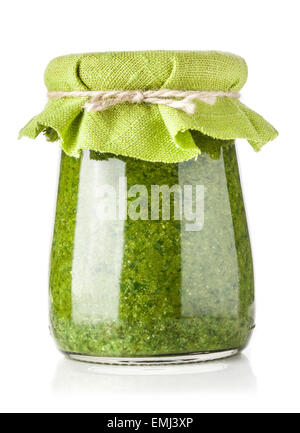 Glass jar of pesto sauce isolated on white Stock Photo