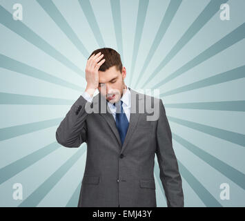 young businessman having headache Stock Photo