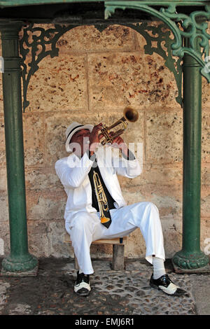 Cuban trumpet player creates music in a small park in Havana Cuba Stock Photo