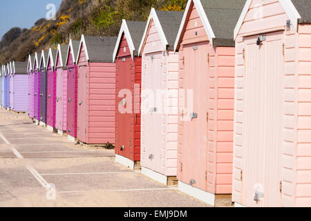 pastel coloured beach huts along the promenade between Bournemouth and Boscombe, Dorset UK in April Stock Photo