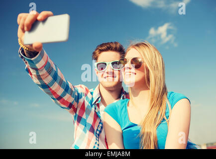 smiling couple having fun outdoors Stock Photo