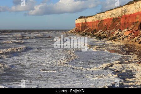 The cliffs at Old Hunstanton on the Norfolk coast with a rough sea. Stock Photo