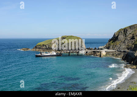 The passenger ferry MS Oldenburg docked at the pier on the island of Lundy in North Devon, England , UK Stock Photo