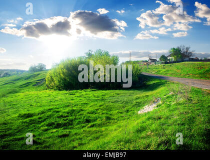 Houses in a small village near green field Stock Photo