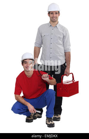 Two electricians working together Stock Photo