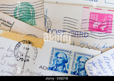 Vintage postcards from the Unite States arranged in a collage showing old stamps, writing and postmarks. Stock Photo