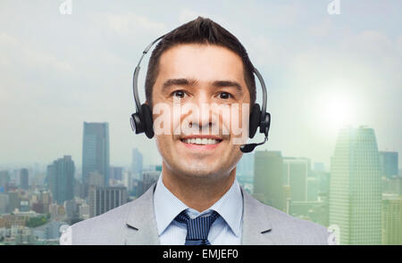 smiling businessman in headset Stock Photo