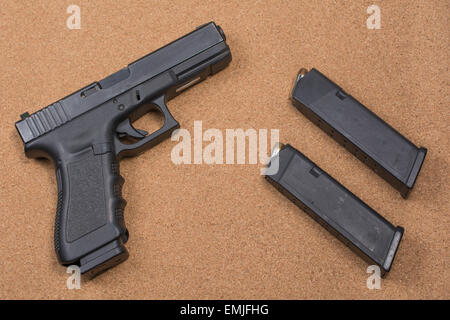 Glock black hand gun with two magazines Stock Photo