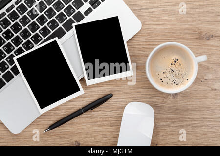 Blank instant photo frames over office table. View from above Stock Photo
