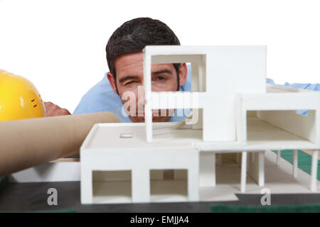 Architect analyzing scale model of building Stock Photo