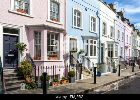 Colourful London street of terraced houses without parked cars. Stock Photo