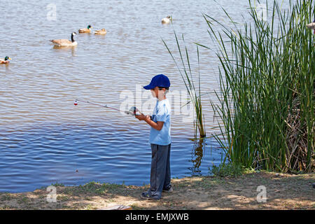 Young boy fishing at Scottsdale Pond, Novato, California, USA Stock Photo