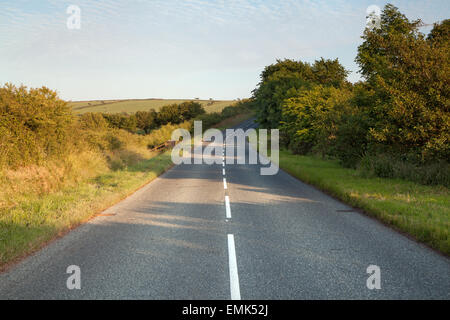 Road running through Pembrokeshire countryside at sunset