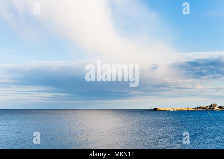 view of calm Ionian Sea near Giardini Naxos resort after rain in spring, Sicily Stock Photo
