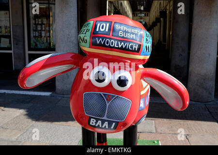 Sean the Sheep at Covent Garden Market, London, England, United Kingdom. Sean is decorated to resemble a red London Bus. Stock Photo