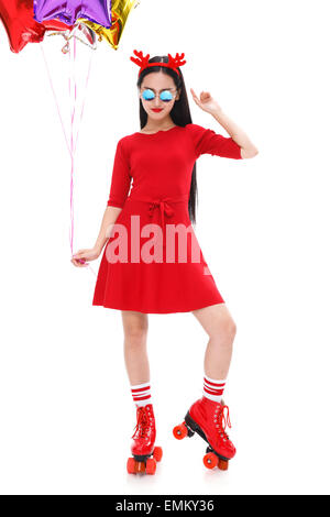 The young woman holding balloons in roller skating Stock Photo