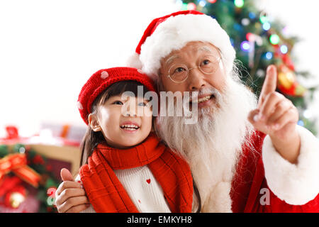 Santa Claus and the little girl for Christmas Stock Photo