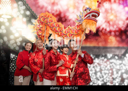 Happy family in Dragon Dance Stock Photo
