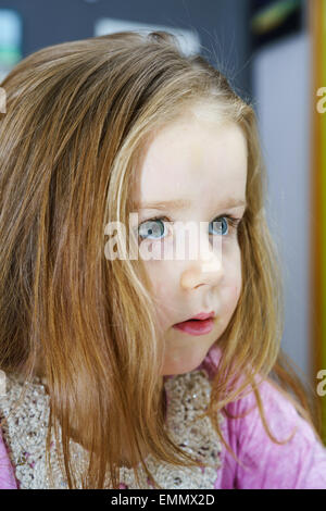 Cute little girl studing to speaking and writing letters at home lesson with her mother Stock Photo