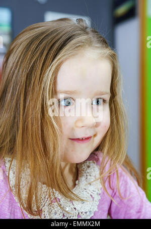 Cute little girl studing to speaking and writing letters at home lesson with her mother Stock Photo