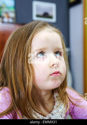 Cute little girl studing to speaking and writing letters at home lesson with her mother Stock Photo