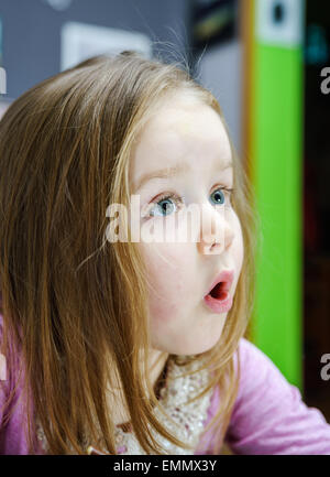 Cute little girl studing to speaking and writing letters at home lesson with her mother Stock Photo