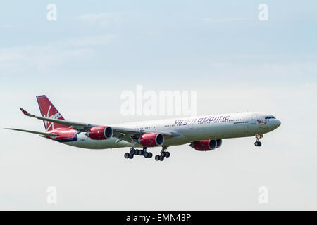 Virgin Atlantic Airbus A340-600 plane, G-VWIN, named Lady Luck, coming in to land. Stock Photo