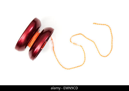 Red yoyo with twine on the white background. Stock Photo