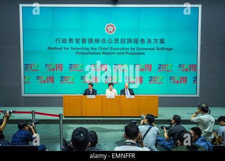 (150422) -- HONG KONG, April 22, 2015 (Xinhua) -- Carrie Lam Cheng Yuet-ngor (C), chief secretary for administration of Hong Kong Special Administrative Region (HKSAR), Secretary for Justice Rimsky Yuen (L), Secretary for Constitutional and Mainland Affairs Raymond Tam, attend a press conference to explain the Method for Selecting the Chief Executive by Universal Suffrage in Hong Kong, south China, April 22, 2015. The HKSAR government revealed a constitutional reform package for the election of the next chief executive by 'one man, one vote' universal suffrage in 2017 on Wednesday.  (Xinhua/He Stock Photo