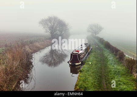 Narrowboat William moored on a misty morning on the Trent and Mersey Canal Stock Photo