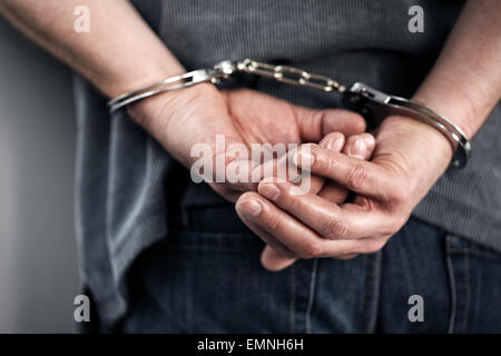 Criminal in handcuffs Stock Photo