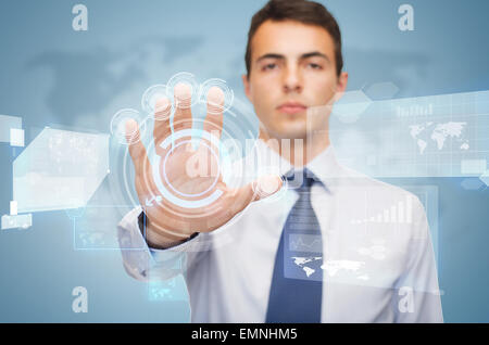 attractive buisnessman working with virtual screen Stock Photo