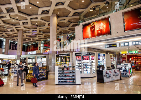 Abu Dhabi United Arab Emirates UAE,International Airport,AUH,terminal,gate,interior inside,duty free,shopping shopper shoppers shop shops market marke Stock Photo