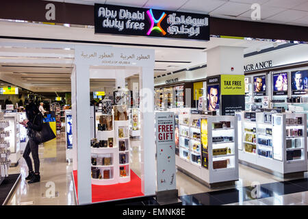 Abu Dhabi United Arab Emirates UAE,International Airport,AUH,terminal,gate,interior inside,duty free,shopping shopper shoppers shop shops market marke Stock Photo