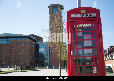 Exterior shot of The Royal Shakespeare Theatre in Stratford-Upon-Avon, UK with a traditional red phone box in bancroft gardens i Stock Photo