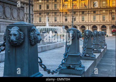 Genoa Piazza de Ferrari, view of the piazza at dawn showing detail of the lion-faced chain posts that enclose the statue of Guiseppe Garibaldi, Genoa. Stock Photo