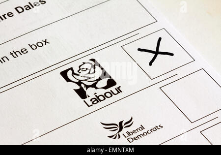 UK General Election ballot paper with boxes marked for voting for different political party candidates with Labour cross in box Stock Photo